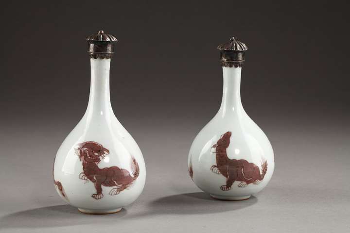 Two vases bottle with copper red decoration of  Mythical animals